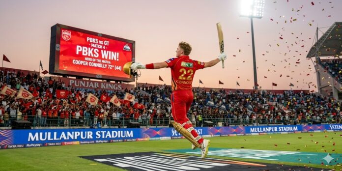 Punjab Kings batsman Cooper Connolly leaps and celebrates with his helmet and bat after scoring the winning runs against Gujarat Titans in IPL 2026 at Mullanpur Stadium.